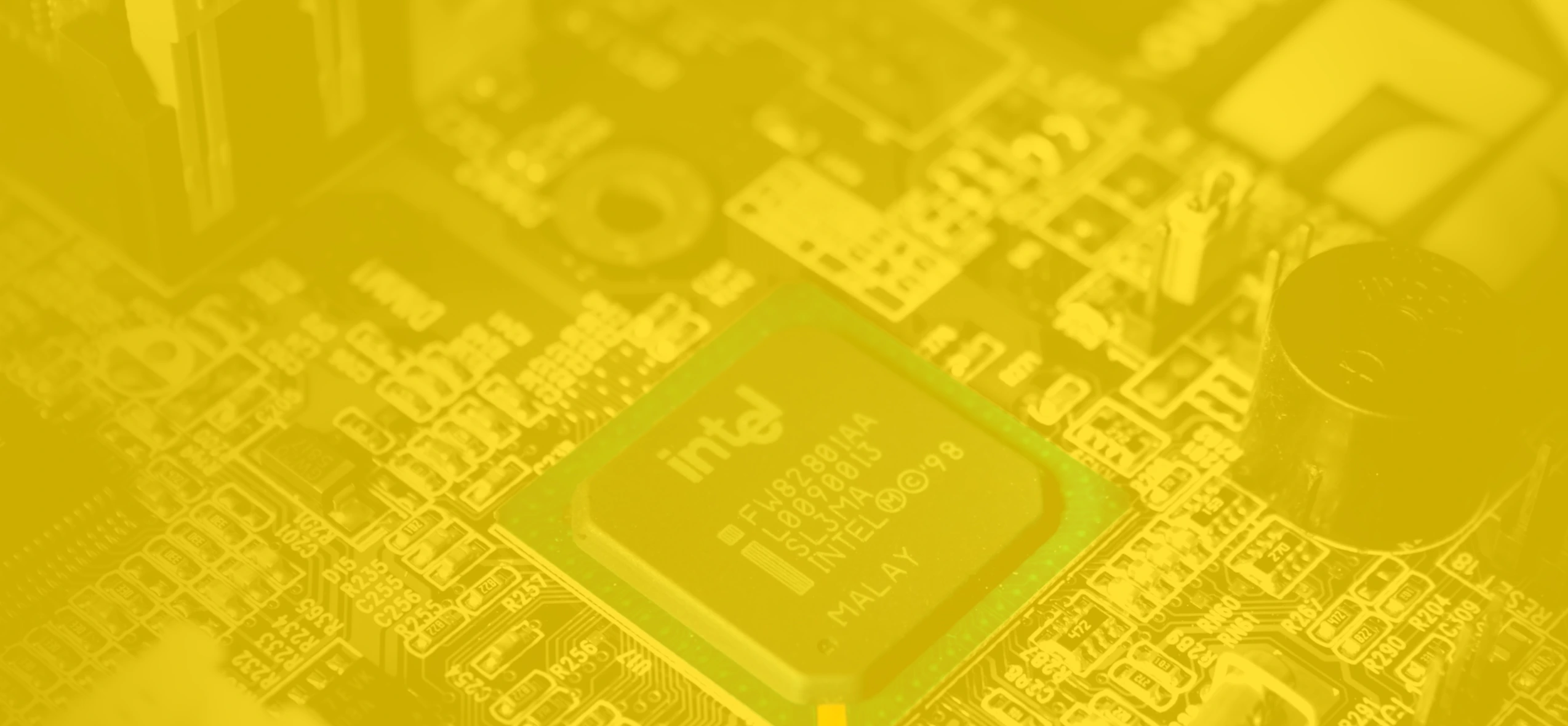 Banner background featuring a yellow-toned Intel motherboard, showcasing intricate circuit details and components